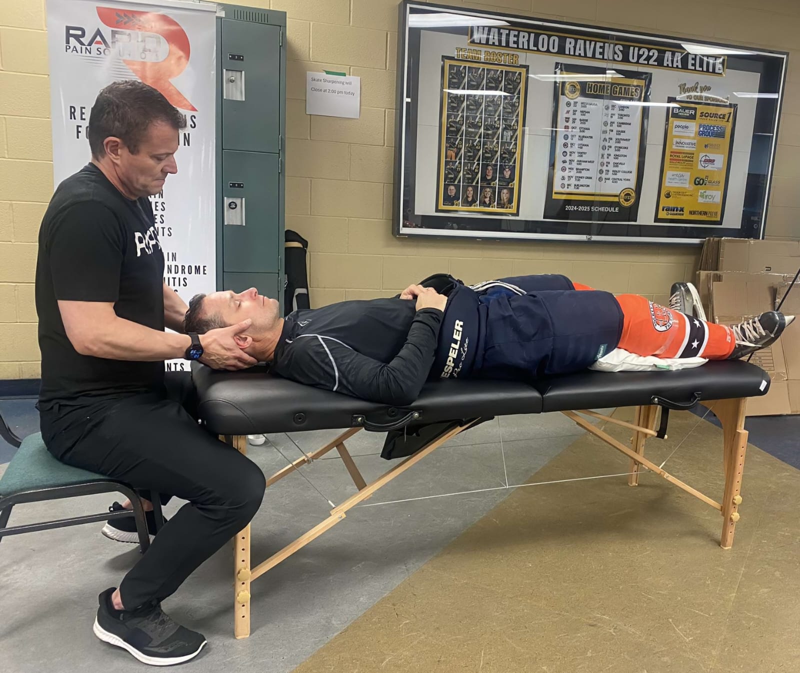 Kevin treating a Waterloo Ravens U22 hockey player at the rink